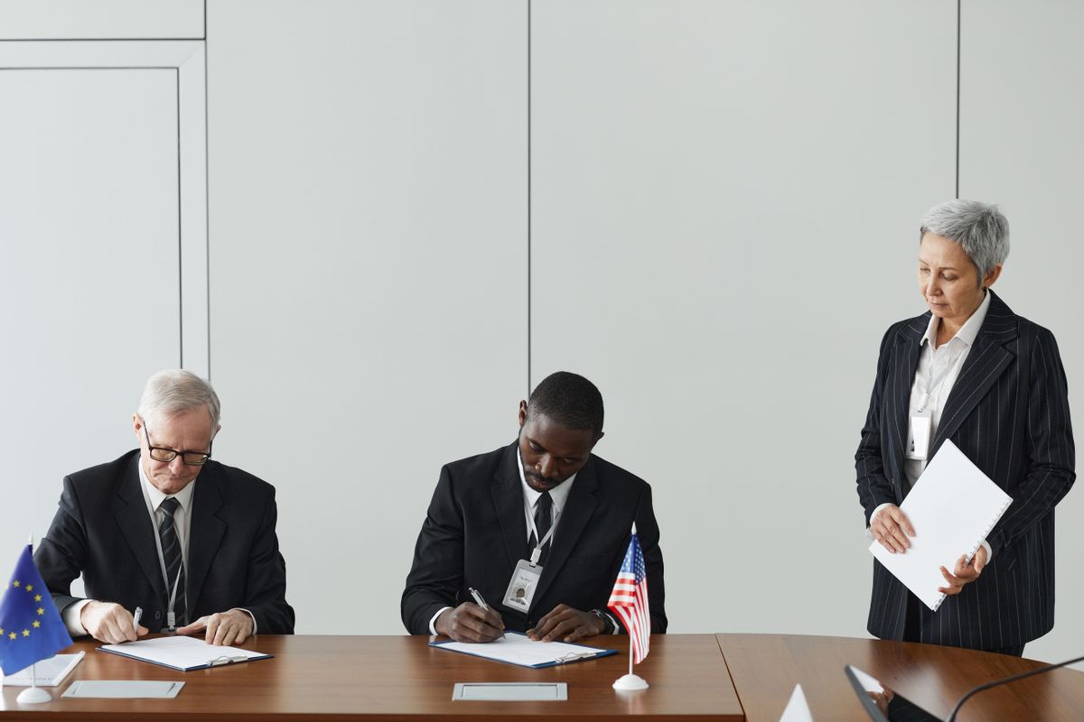 Illustrative executives negotiating a corporate agreement, not the actual chambers